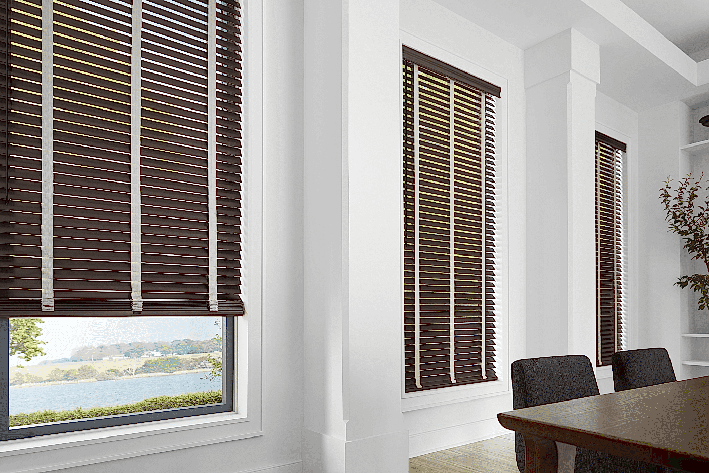 dark-wood-window-blinds-decorative-tape-classic-dining-room Dark wood window blinds with contrasting white decorative ladder tapes on multiple windows in a bright classic dining room in Omaha